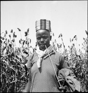 A woman wearing a ligisa on her head, a beaded cap among the Luo community in Kenya at times decorated with cowrie shells.