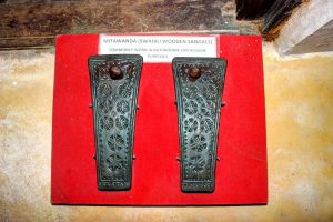 These are mitawanda, wooden sandals without straps used by the Swahili people along the coast of Kenya. They were typically footwear for hygiene, used in bathrooms