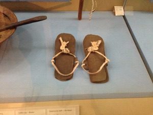 A pair of kwegh, sandals made from buffalo hide secured with leather straps. They were popular footwear among the pastoralist communities of Kenya