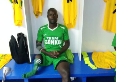 Sakwa Lumbasi seated in a locker room